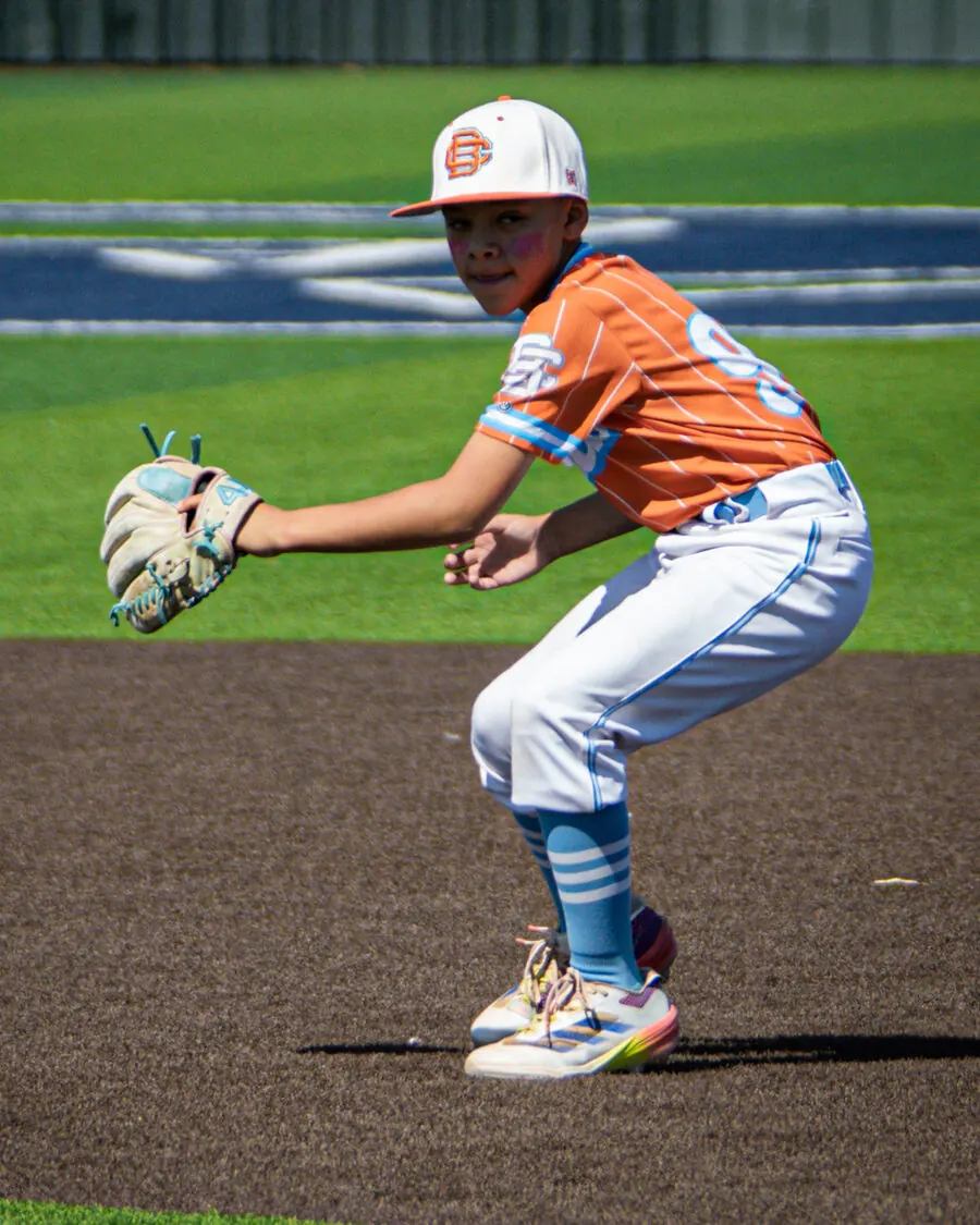 Young TX Torque infielder in a ready fielding position